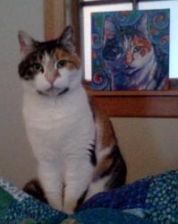 Catalina sitting in front of her portrait